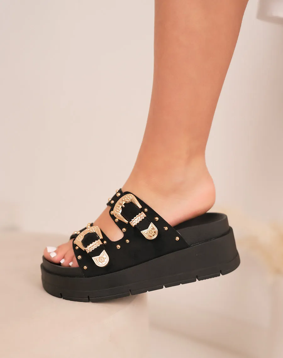 Mules femme noires à grosse plateforme tendance avec boucles dorées